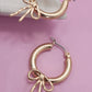 WORN GOLD BOW PUFFY HOOP EARRINGS