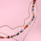 MULTI LAYERED BEADED HEART CHARM NECKLACE