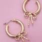 WORN GOLD BOW PUFFY HOOP EARRINGS