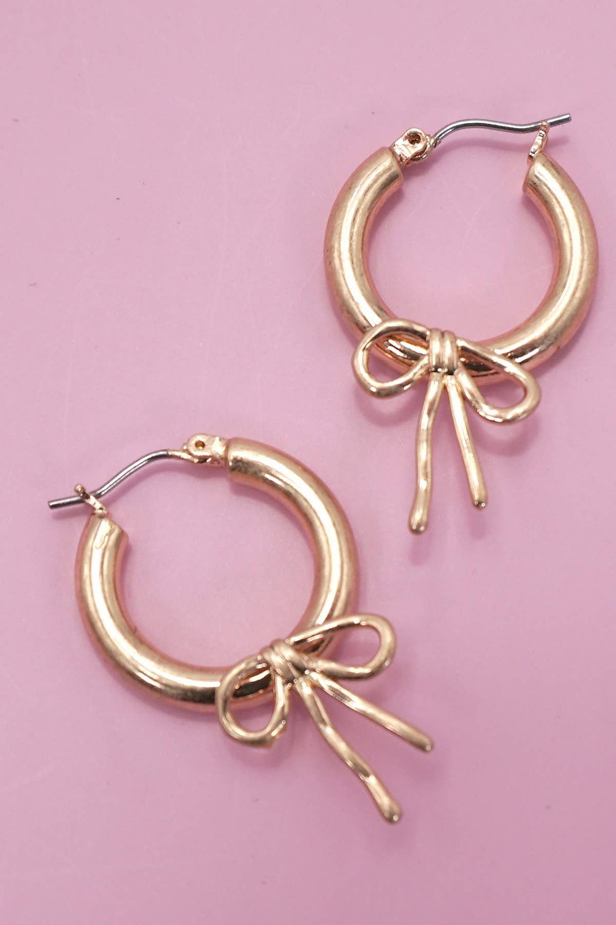WORN GOLD BOW PUFFY HOOP EARRINGS